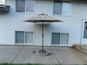lot 60 image: Patio Umbrella and Iron Stand