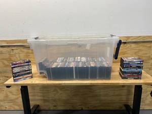 lot 52 image: Bin full of DVDs