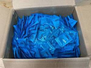 lot 84 image: Box full of Individually Packaged Bubbles for Bubble Machines. (15 ml per packet)