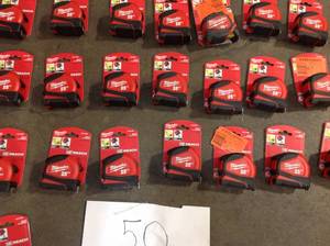 lot 35 image: 50 units of Milwaukee Tape Measurers (review all pictures)