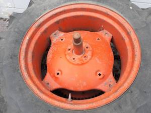 lot 113 image: 24 Tractor Tire - Armstrong 12.411-24 Tractor Tire on Rim - Good Shape