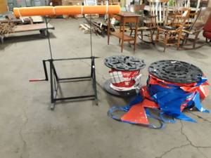 lot 239 image: (2) Rolls of Flags and Stand to quickly roll them back up Works with a Cordless Drill