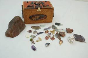 lot 138 image: Cigar box and stones