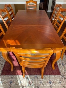 lot 2 image: Delightful Dining Room Table with 8 Charming Chairs from Wickes Furniture