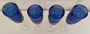 lot 5 image: Four Cobalt Blue Stemmed Champagne Glasses