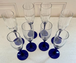 lot 6 image: 2 Sizes of Cobalt Blue Glass Champagne Flutes