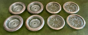 lot 19 image: 8 Glass Coasters with Sterling Overlay in 2 Different Designs