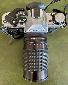 lot 74 image: Canon AE-1 Program Camera with Accessories
