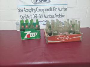 Collectable glass bottles. Coca-Cola wooden box and 7 up carrier