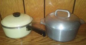 Cast Aluminum Wagner Ware Dutch Oven and Saucepan with lids.