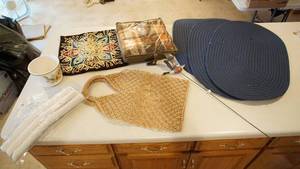 lot 140 image: Three Oval Navy Blue Braided Rugs-Carrying Bag-Outdoors Duck Shaped Yard Or Garden Stake-Plaid Lap Blanket-White Ceramic Flower Pot-Three Padded Hangers