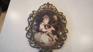 lot 141 image: Brass Oval Picture Frame With A Picture Of A Young Girl Hugging Her Dog--(Item CET-176--Made In Italy)