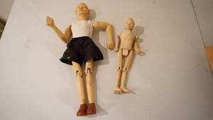lot 214 image: Two Hand Carved Wooden Dolls