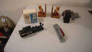 lot 226 image: Black Dahle 55 Pencil Sharpener--Two Wooden Book Ends-Swingline - Inc. (State Of Minnesota) Stapler--Avon Rolls Royce Deep Woods After Shave Container