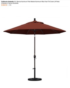 California Umbrella 9 ft. Bronze Aluminum Pole Market Aluminum Ribs Push Tilt Crank Lift Patio Umbrella in Henna Sunbrella & Pstone Black Umbrella Base. See Pictures