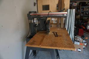 lot 1 image: Craftsman Model 10 Blade Out RipRadial Arm Saw With Wheeled Metal Stand