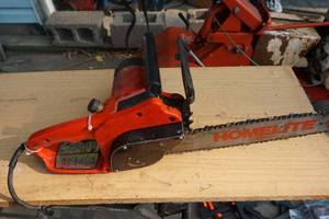 lot 48 image: Homelite Model XEL 12 Electric Chain Saw