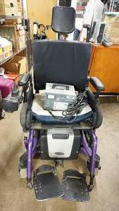 lot 2 image: Invacare Electric Wheel Chair And Battery & Charger