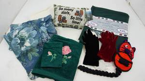 lot 20 image: American Spirit Sweatshirt Throw (Sportswear For The Home--Two Flowered Pillow Shams--White Tablecloth-Dark Green Bath Towel & Washcloth--Two Pr. Of Gloves--Small Pillow