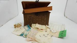 lot 29 image: Brown Sewing Box--Special Needle Assortment-Small Measuring Tape--Eight Ladies Hankies--Vintage Avon Lipstick Compact W Mirror & Sachet Holder