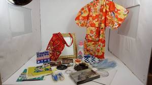 lot 34 image: 8  X  10 Picture Frame--Set Of Two Full Page Magnifiers--Scouring Stick--16 Fl. Oz. Woolite--Manaicure Set--Little Girls Kimona--Coin Caddy--A Red Apron From Portugal--Etc.