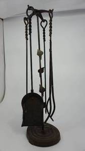 lot 86 image: Four Piece Cast Iron Fireplace Tools