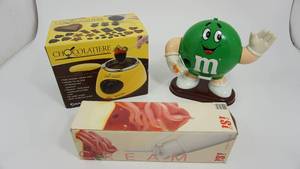 lot 93 image: White iSi Dessert Whip--Electric Excalibur Chocolateiere Chocolate Melting Pot--MARS Incorporated 1992 M & M Despenser