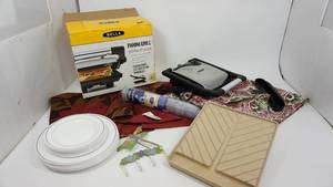 lot 100 image: Bella Panini Grill--Twelve Plastic Dinner Plates--Sixteen Plastic Salad Plates--Microwaveble Tray For In The Microwave--Pastry Mat--Two Table Runners--Butterfly Wall Hanging