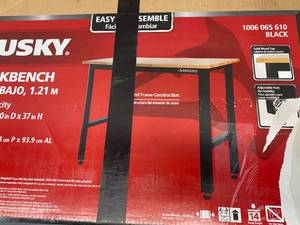 lot 21 image: HUSKY 4 ft. Black Solid Wood Workbench