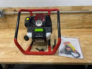 lot 50 image: EARTHQUAKE Dually 52cc 1- or 2-Person Earth Auger Powerhead, 10310