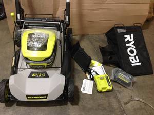 lot 34 image: Ryobi Push Lawn Mower Includes bag battery and charger  See Pictures