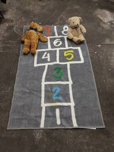 lot 25 image: Hop Scotch Rug and Two Stuffed Bears
