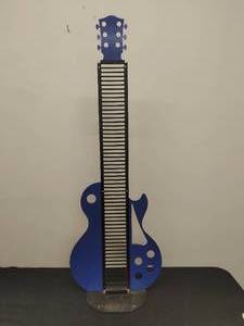 lot 47 image: Guitar Shaped CD Holder