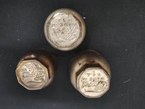 lot 138 image: Collection of Three Ford Metal Caps Over 100 Years Old