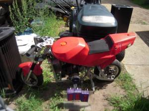 lot 7 image: Pocket Rocket mini bike for parts or repair. Has compression. As shown.