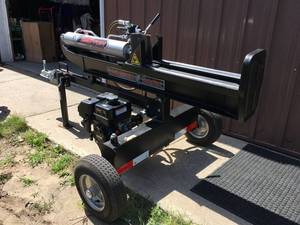 lot 1 image: 25 ton Lumber Jack log splitter. Horizontal or vertical. Like new condition. Used once. Is a working unit. As shown. THIS ITEM HAS A RESERVE.
