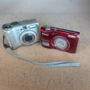 lot 99 image: Nikon Coolpux 16.1MP and Canon 3.2M...