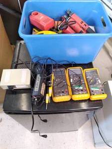 lot 159 image: Tote of Fluke Multimeter Testing Un...