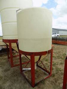 lot 10 image: Cone Bottom Poly Tank and Stand with Valves