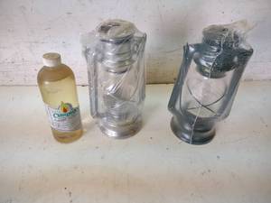lot 83 image: (2) Brookstone Oil Lamps & Oil...