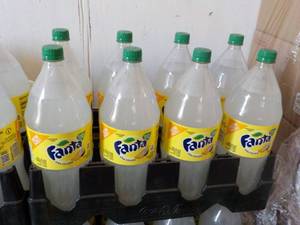 lot 343 image: 8 - 2 liter Bottles Fanta Pina Cola...