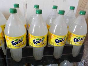 lot 344 image: 8 - 2 liter Bottles Fanta Pina Cola...