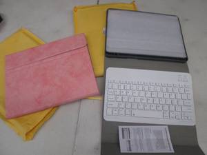 lot 204 image: 3 Pink Bluetooth Keyboard Cases...