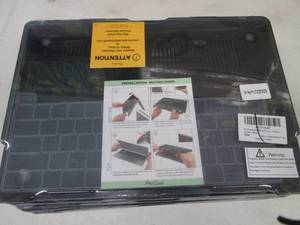 lot 219 image: 10 Macbook Pro Skins...