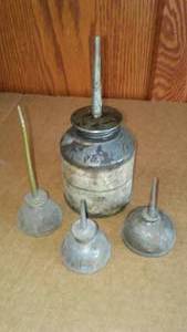 lot 304 image: Antique oil cans (4).