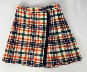 lot 104 image: Two Iconic 1960s Girls Skirts - Pleated Plaid Wrap w Lg. Pin and Floral Print, Size 10-12