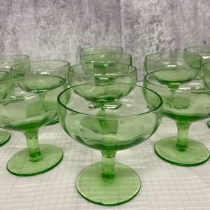 lot 210 image: Sixteen Uranium Glass Sherbet Dishes and Anchor Hocking Covered Dish