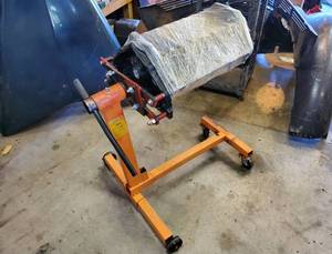lot 37 image: Motor Stand With a Chevy 350 engine Block
