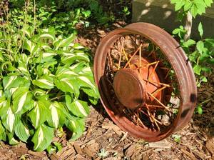 lot 87 image: Vintage Automotive Rim Garden Decor