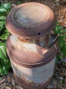 lot 113 image: Yard Decor Milk Can